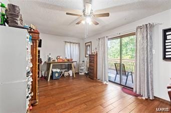 miscellaneous room with ceiling fan and dark hardwood / wood-style floors