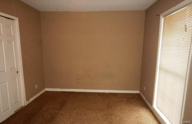 unfurnished bedroom with carpet