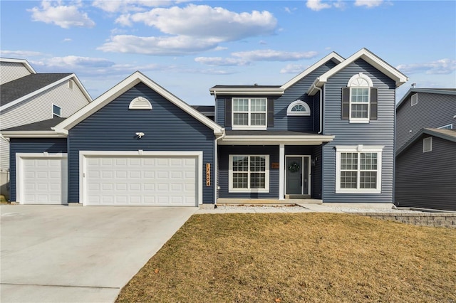 traditional-style house with a garage, a front lawn, and concrete driveway