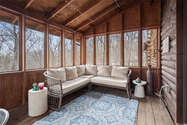 unfurnished sunroom with lofted ceiling and wood ceiling