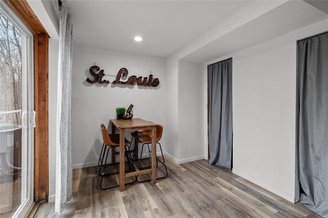 dining room featuring recessed lighting, baseboards, and wood finished floors