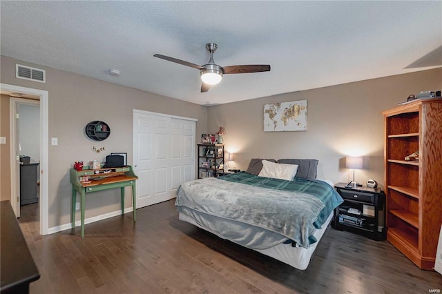 bedroom with ceiling fan and dark hardwood / wood-style flooring