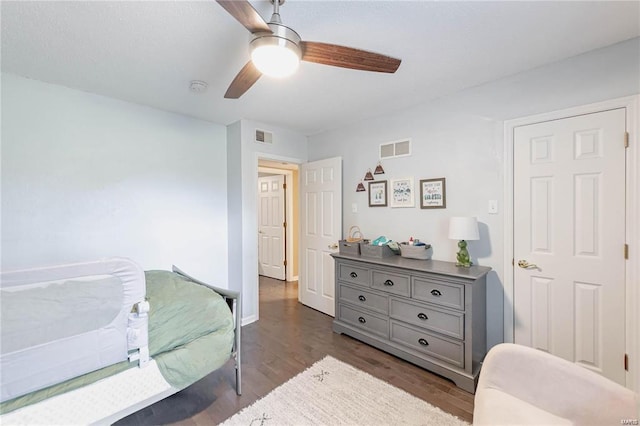 bedroom featuring dark hardwood / wood-style floors and ceiling fan