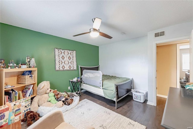 bedroom featuring dark hardwood / wood-style floors and ceiling fan