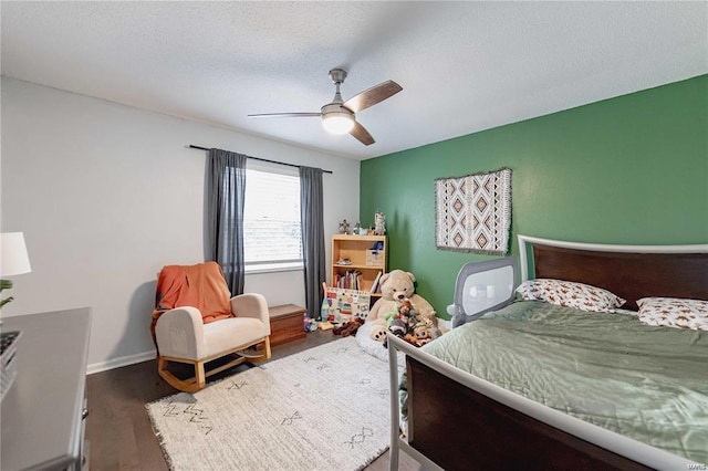 bedroom featuring ceiling fan and dark hardwood / wood-style flooring