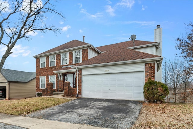 colonial inspired home with a garage