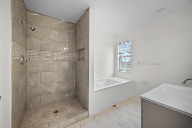 bathroom with vanity and separate shower and tub