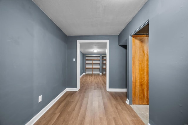 hall with light wood-type flooring