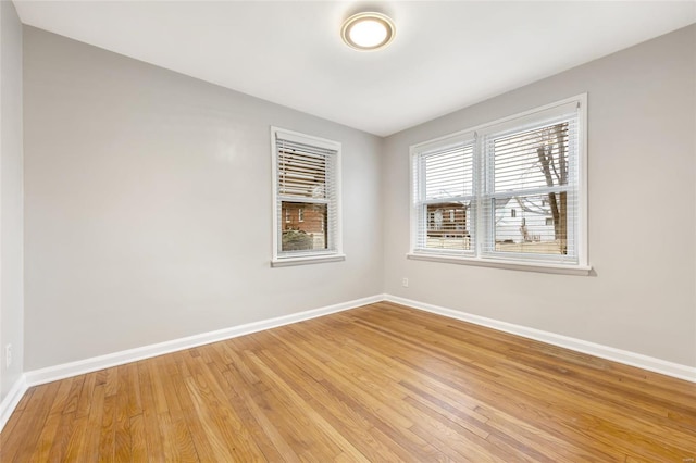 spare room featuring light hardwood / wood-style flooring