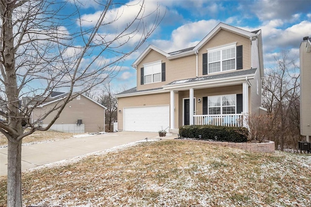 front of property with a garage and a porch