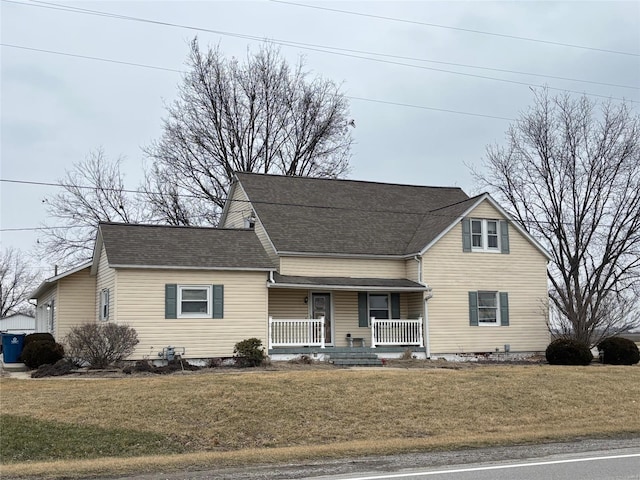 view of front of home featuring a front lawn and covered porch