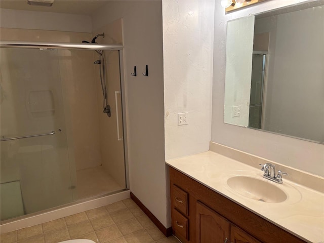 bathroom featuring vanity and an enclosed shower