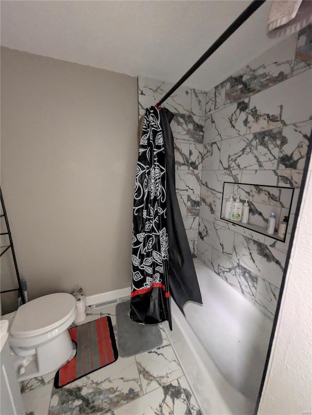 full bathroom featuring marble finish floor, toilet, and a shower with curtain