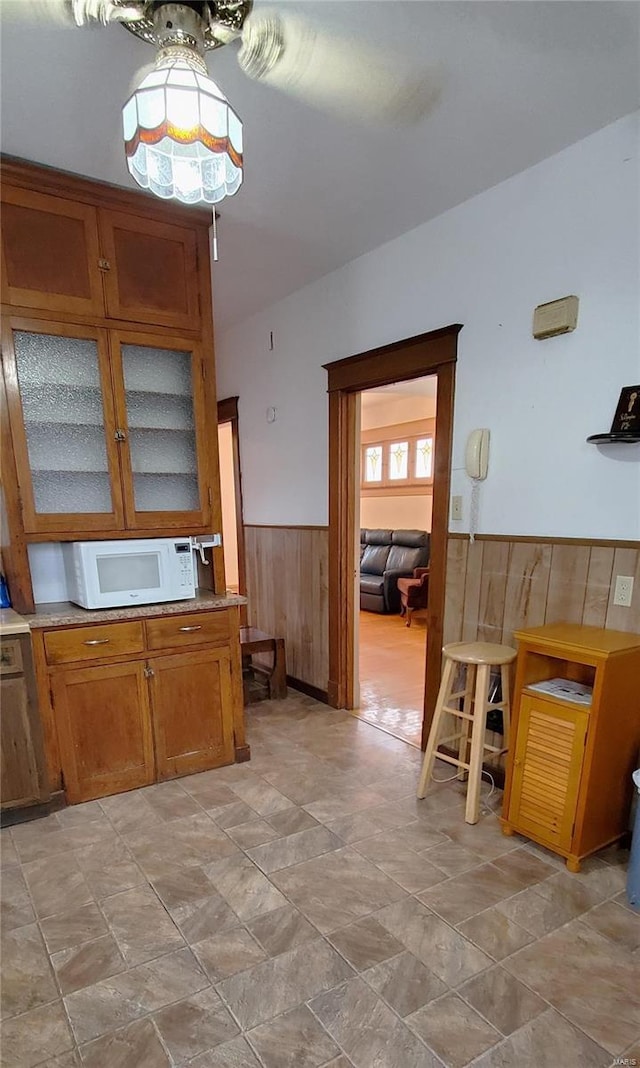 kitchen featuring wood walls