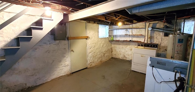 basement with washer / clothes dryer, electric panel, and water heater