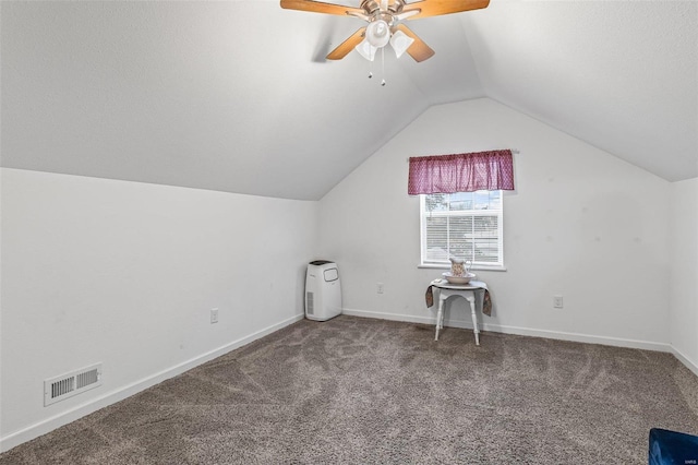 additional living space with lofted ceiling, ceiling fan, and carpet flooring