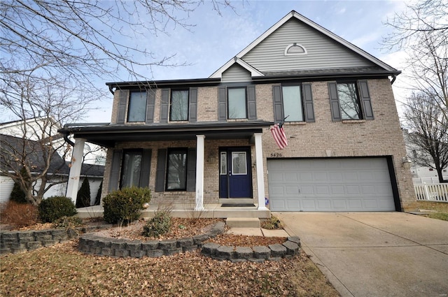 view of front of house featuring a garage and covered porch