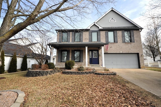 view of front of property with a garage and a porch