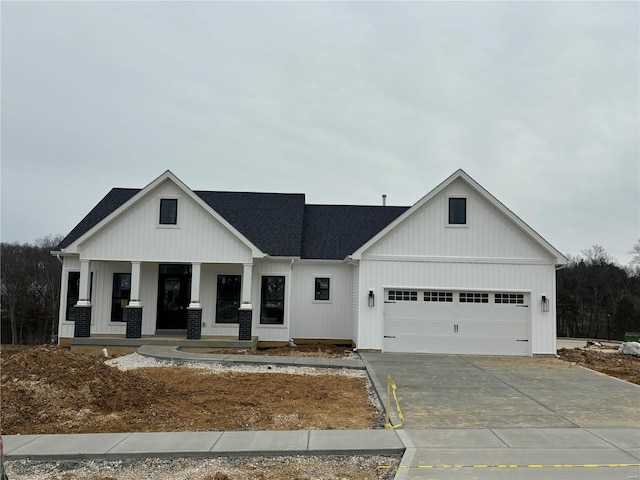 view of front of house with a garage and covered porch