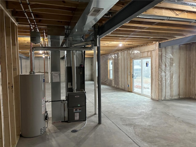 basement with water heater and visible vents