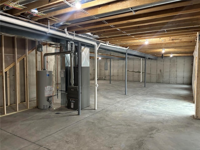 unfinished below grade area with gas water heater and heating unit