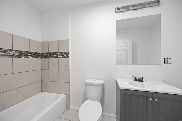 bathroom featuring toilet, tile patterned flooring, baseboards, and vanity