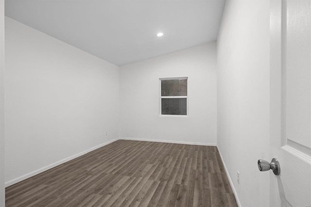 spare room with dark wood-style floors, recessed lighting, and baseboards