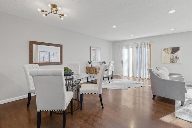 dining space featuring recessed lighting, wood finished floors, baseboards, and a chandelier