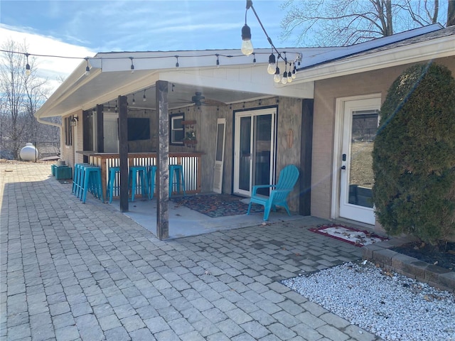 exterior space featuring ceiling fan