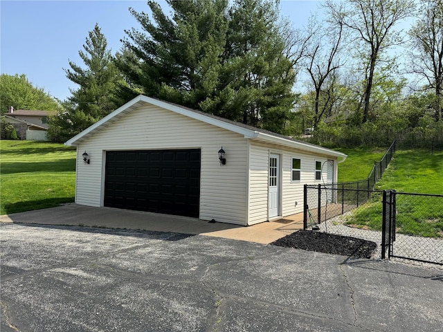 detached garage featuring fence