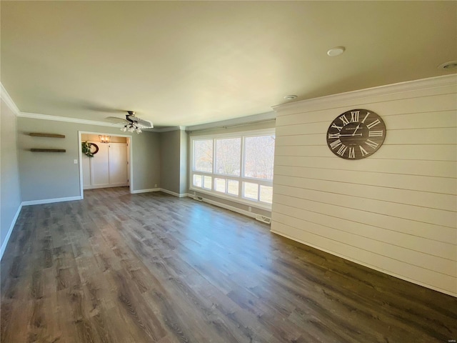 unfurnished living room with crown molding, baseboards, ceiling fan, and dark wood-style floors