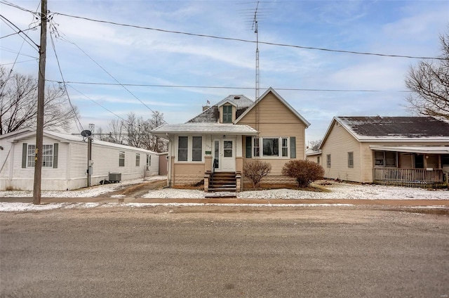 view of front of home featuring central AC unit