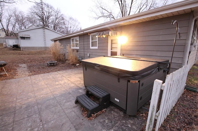 view of patio / terrace with a hot tub