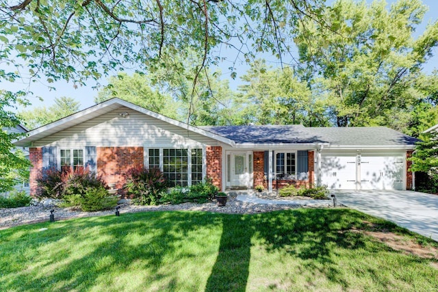 ranch-style home featuring a front lawn and a garage