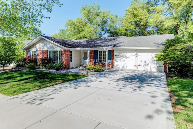 ranch-style house featuring a front lawn and a garage