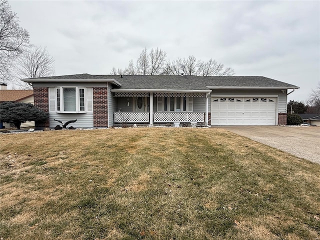 ranch-style house with a garage, covered porch, and a front lawn