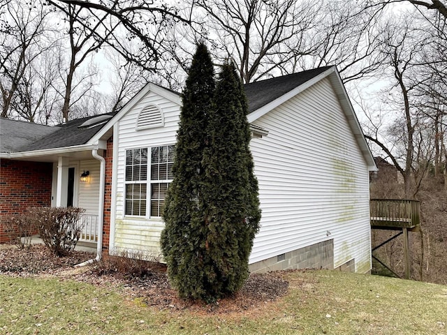 view of property exterior with a lawn