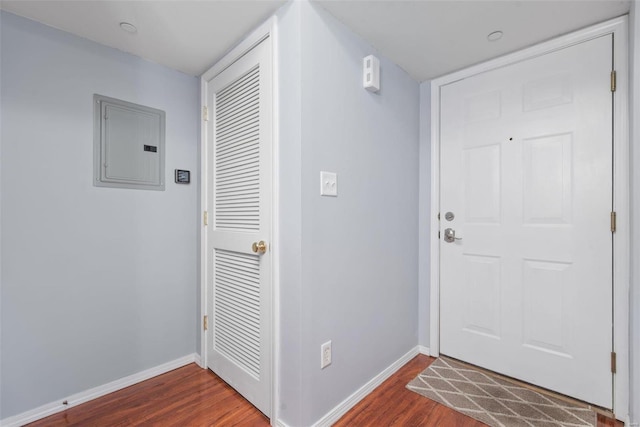 entryway featuring electric panel and dark hardwood / wood-style floors