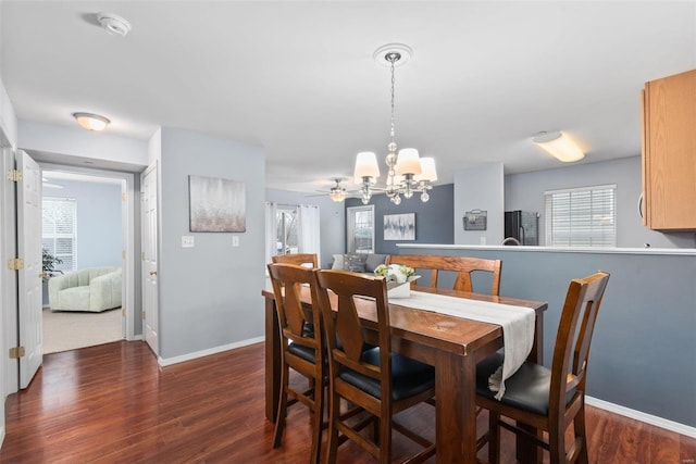 dining room featuring a chandelier and dark hardwood / wood-style flooring