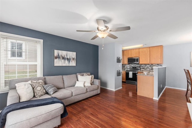 living room with dark hardwood / wood-style floors and ceiling fan