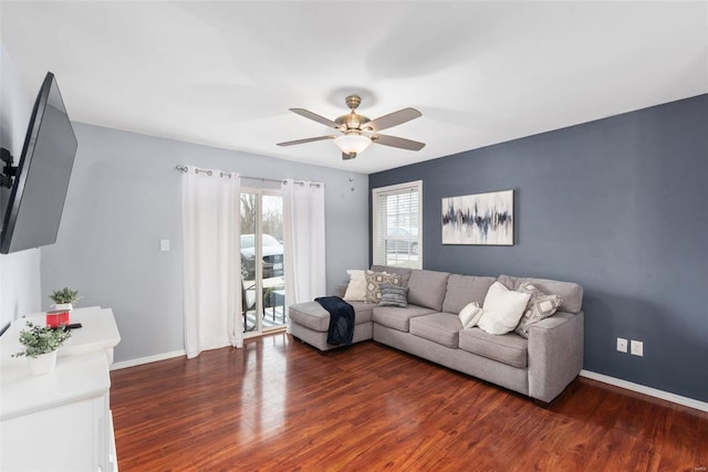 living room with dark hardwood / wood-style floors and ceiling fan