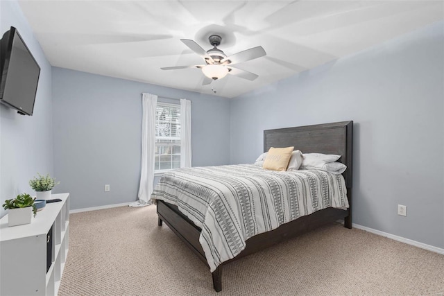 bedroom with light colored carpet and ceiling fan