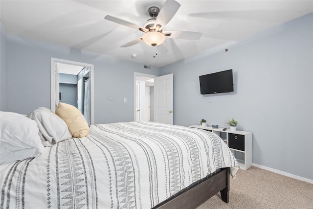 bedroom with light colored carpet and ceiling fan