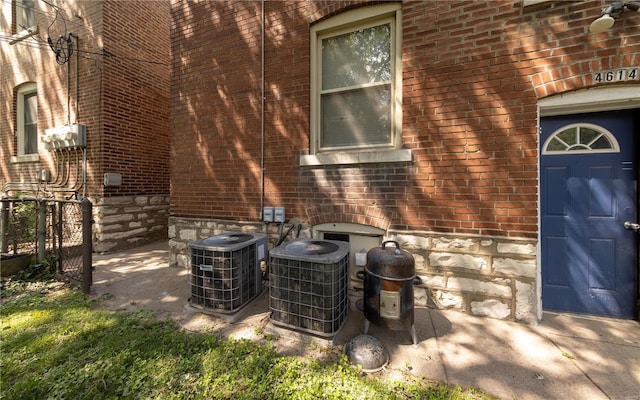 details with cooling unit and brick siding