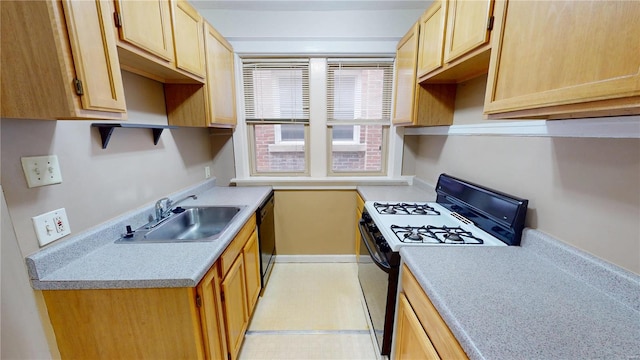 kitchen with light floors, light countertops, light brown cabinets, a sink, and black appliances