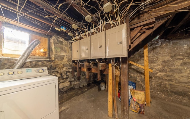 below grade area featuring washer / dryer and electric panel