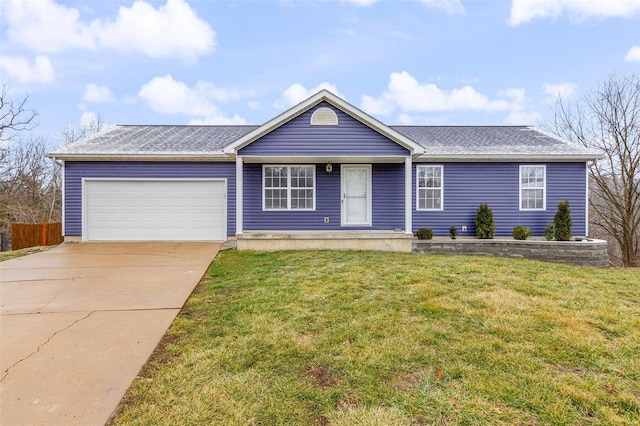 ranch-style house featuring a garage and a front yard