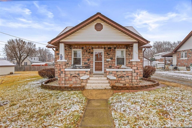 bungalow-style house with a front lawn