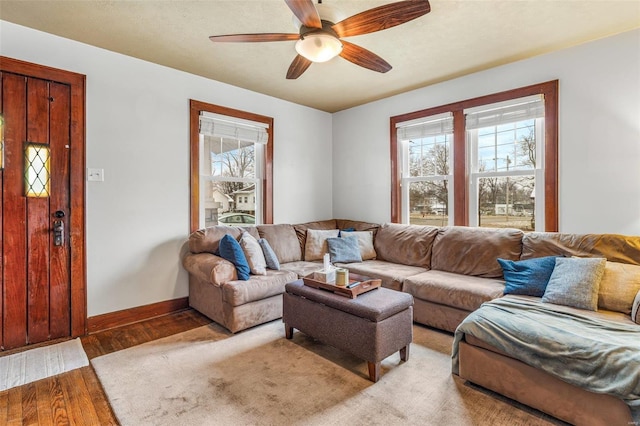 living room featuring hardwood / wood-style floors, plenty of natural light, and ceiling fan