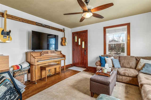 living room with hardwood / wood-style floors and ceiling fan